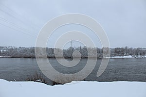 Winter landscape. River lake without ice swamp plants neg. winter entertainment. Plants in the snow photo