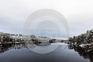 Winter landscape, open water in the Otra river, South part of Norway photo
