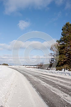 Winter landscape with a road