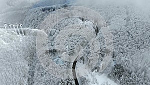 Winter landscape,road and snow covered trees.