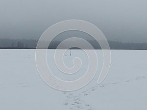 Winter landscape, Russia. Scenery of winter lake with fisherman