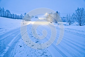 Winter landscape in Scandinavia. Snowy road with snow covered trees. Landscape