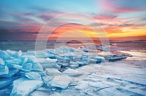 Winter landscape on seashore during sunset. Lofoten islands, Norway.