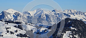 Winter landscape seen from Horneggli, Switzerland. Snow covered mountain ranges