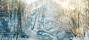 Winter landscape of small forest stream