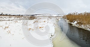 Winter landscape with small Ukrainian river Sura.