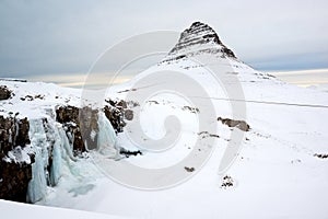 Winter landscape with snow-capped Kirkjufell mountain, Snaefellsnes peninsula, Iceland