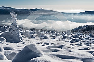 Winter landscape from snow capped mountainside