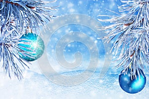 Winter landscape with snow. Christmas background with fir branch and Christmas ball.Merry Christmas and happy New Year greeting ca