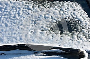 Winter landscape. snow covered car. Sunny day, heavy frost.