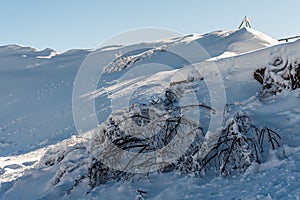 Winter landscape of snow covered mountains with blue sky in sunny day. Rochers de Naye