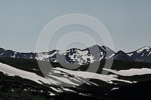 Winter landscape with snow-covered mountains in the distance in Colorado