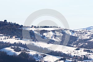 Winter landscape with snow and fog in the Tosco Emiliano Apennines, Bologna, Italy