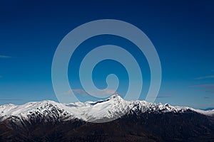 Winter landscape of snow mountain against blue sky in South island, New Zealand