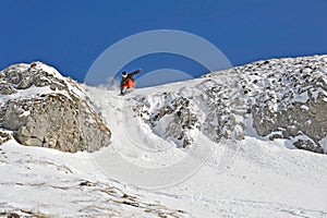 Winter landscape with a snowboarder