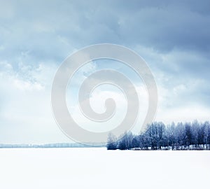 Winter Landscape with Snowy Field and Moody Sky