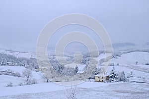Winter landscape. Snowy hills, homes, nature, horizon. Natural background. Appennino Tosco-emiliano national park photo