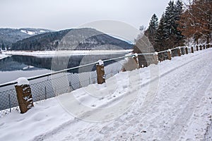 Winter landscape at Soesetalsperre in Harz Mountains National Park, Germany. Moody snow scenery in Germany