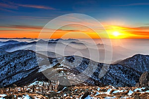 Winter landscape with sunset and foggy in Deogyusan mountains.