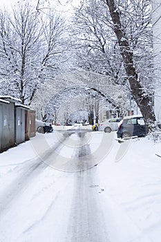 Winter landscape vertickal image with city street cars