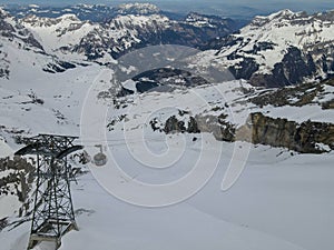 Winter landscape view at the cable car to mount Titlis over Engelberg in the Swiss alps