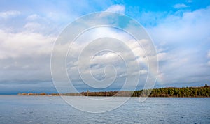 Winter landscape of Vistula river estuary to Baltic Sea with rainbow on Wyspa Sobieszewska island near Gdansk in Poland