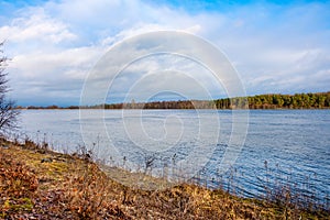 Winter landscape of Vistula river estuary to Baltic Sea with rainbow on Wyspa Sobieszewska island near Gdansk in Poland