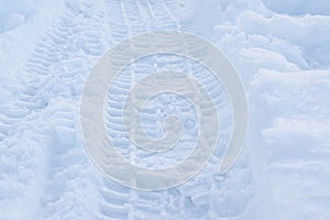 Winter landscape wallpaper. Tire track on snow, 4x4. Textured background