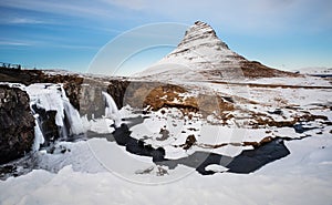 Winter landscape, waterfall with mountain Kirkjufell in Iceland