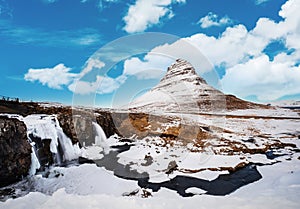 Winter landscape, waterfall with mountain Kirkjufell in Iceland