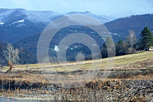 Winter landscape with a white church in the background