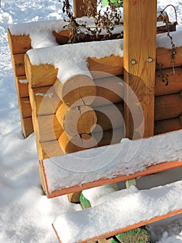 Winter landscape  with wooden gazebo, bench   in  white snow