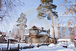 Winter landscape with the wooden house