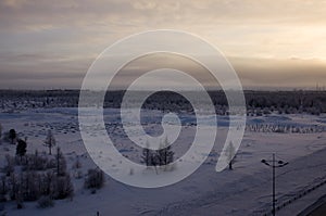 Winter landskape with forest in snow in the evening sunset. North