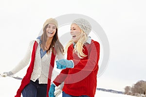 Winter, laughing and lesbian couple outdoor in snow on romantic vacation, adventure or holiday. Love, happy and queer