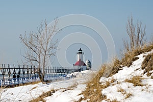 Winter light house in michigan photo
