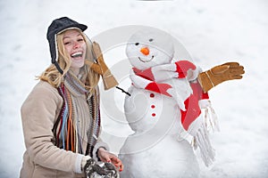 Winter love concept. Making snowman and winter fun. Give a wink. Young woman winter portrait. Sensual winter girl wiht