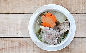 Winter melon soup with pork spare rib on wood background.