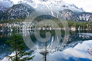 The winter mirror of Lake Tovel in Trentino, Italy photo