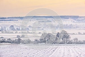 Winter mist over snow-covered fields