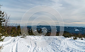 Winter Moravskoslezske Beskydy mountains from hiking trail beloow Lysa hora hiill summit in Czech republic photo