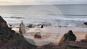 Winter morning on the ocean at Praia de Amado in Portimao, Algarve, Portugal