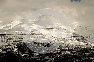 Winter mountain covered in clouds photo