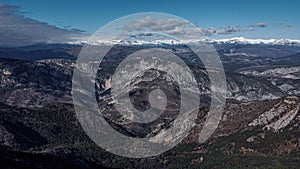 Winter mountain and hillside landscape, drone aerial view with snow, patterns, shapes and trees