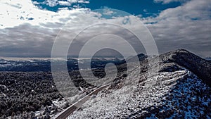 Winter mountain and hillside landscape, drone aerial view with snow, patterns, shapes and trees