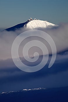 Winter mountain landscape with fog in the Giant Mountains on the Polish and Czech border - Karkonosze National Park.