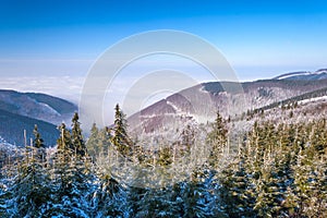 Winter mountain landscape with fog in valley, Pustevny.