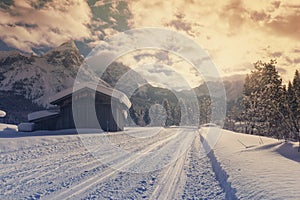 Winter mountain landscape with groomed ski track