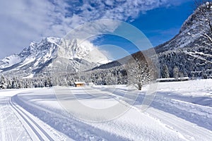 Winter mountain landscape with groomed ski trails