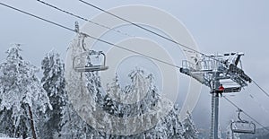 Winter mountain landscape with with modern ski lift chair